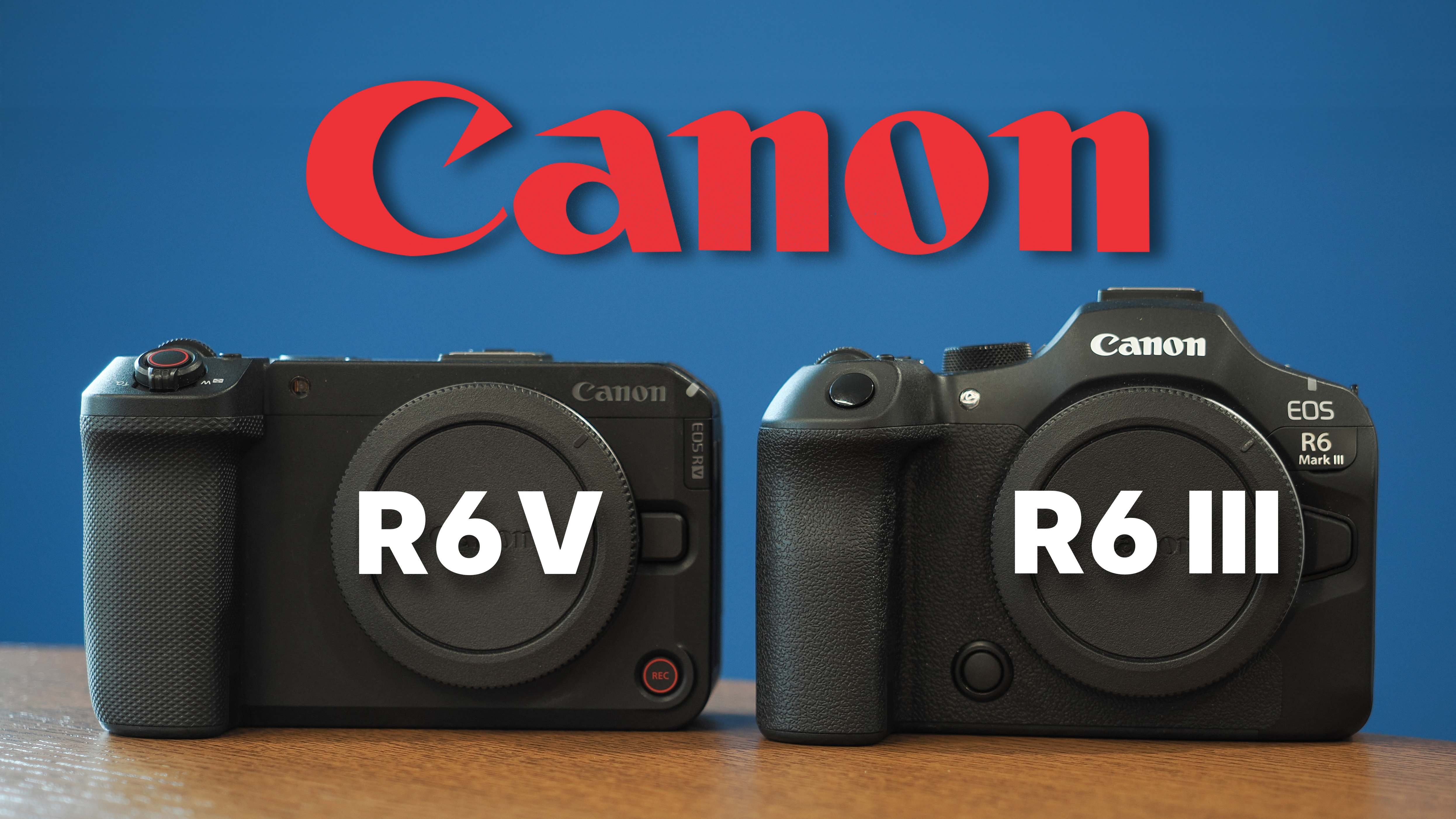 Canon EOS R6 V and R6 Mark III on a wooden surface, in front of a blue background with the Canon logo