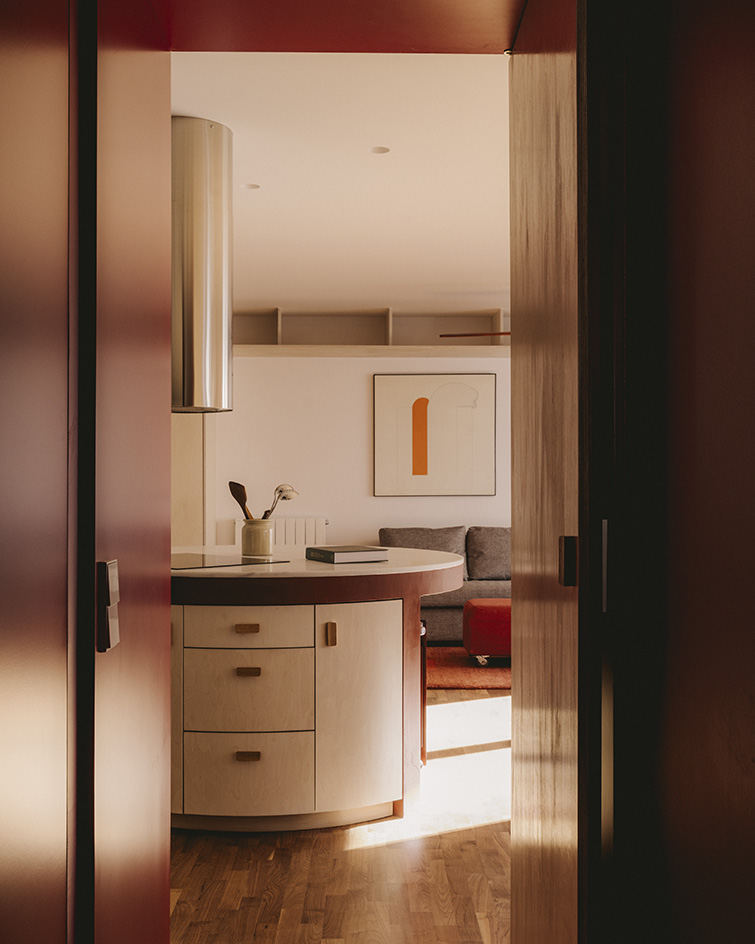 interior views of warm Barcelona apartment in red and neutral tones