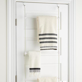 a door rack with towels hanging on it