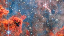 A glittering starscape in pink and blue taken by the Webb telescope
