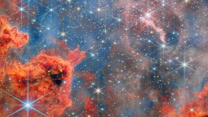 A glittering starscape in pink and blue taken by the Webb telescope
