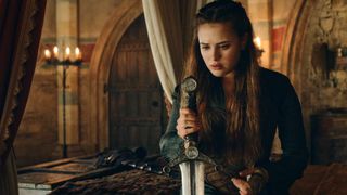 Katherine Langford as Nimue holds a sword in Cursed