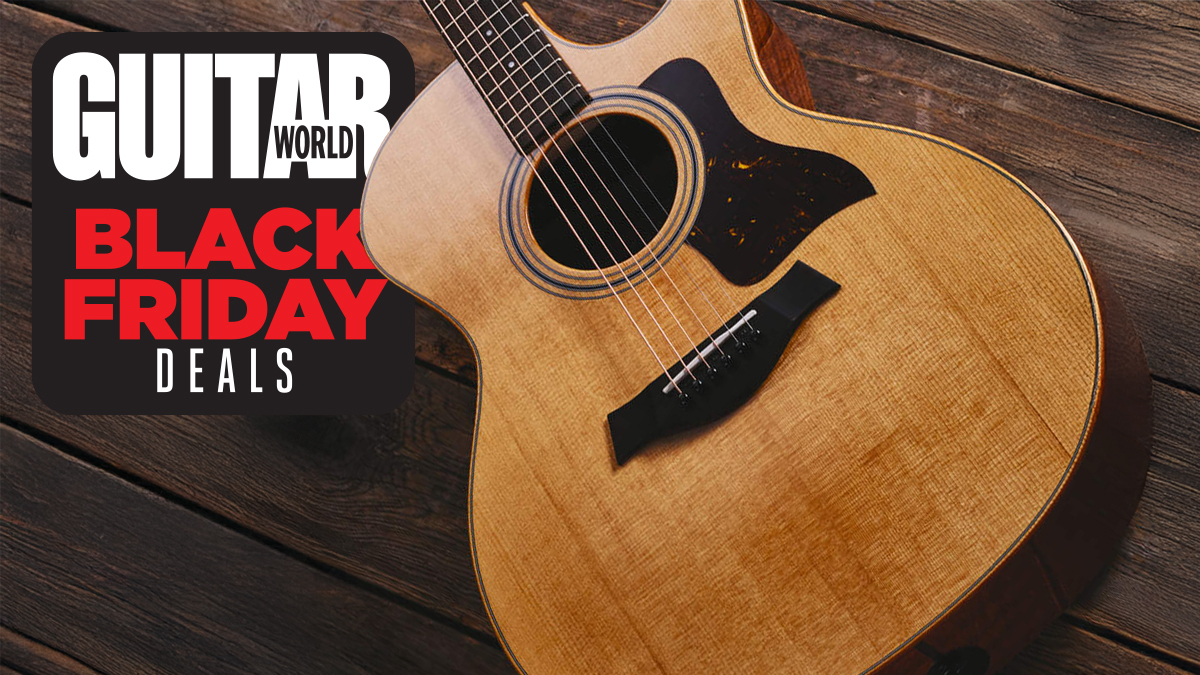 Taylor acoustic guitar on a wooden floor