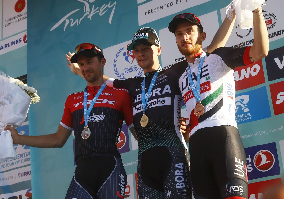 The podium of Theuns, Bennett and Consonni (L-R)