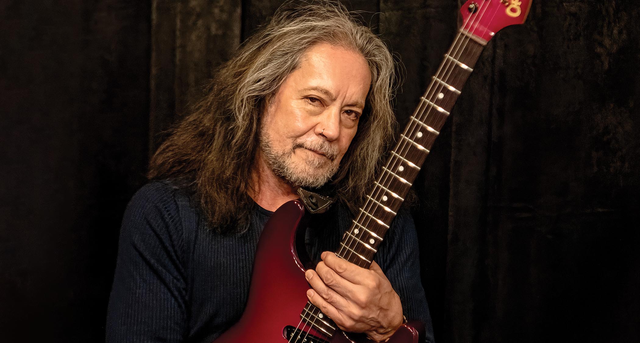Jake E. Lee photographed July 5 in Birmingham, England, with the custom Purple Burst Charvel he played at Back to the Beginning