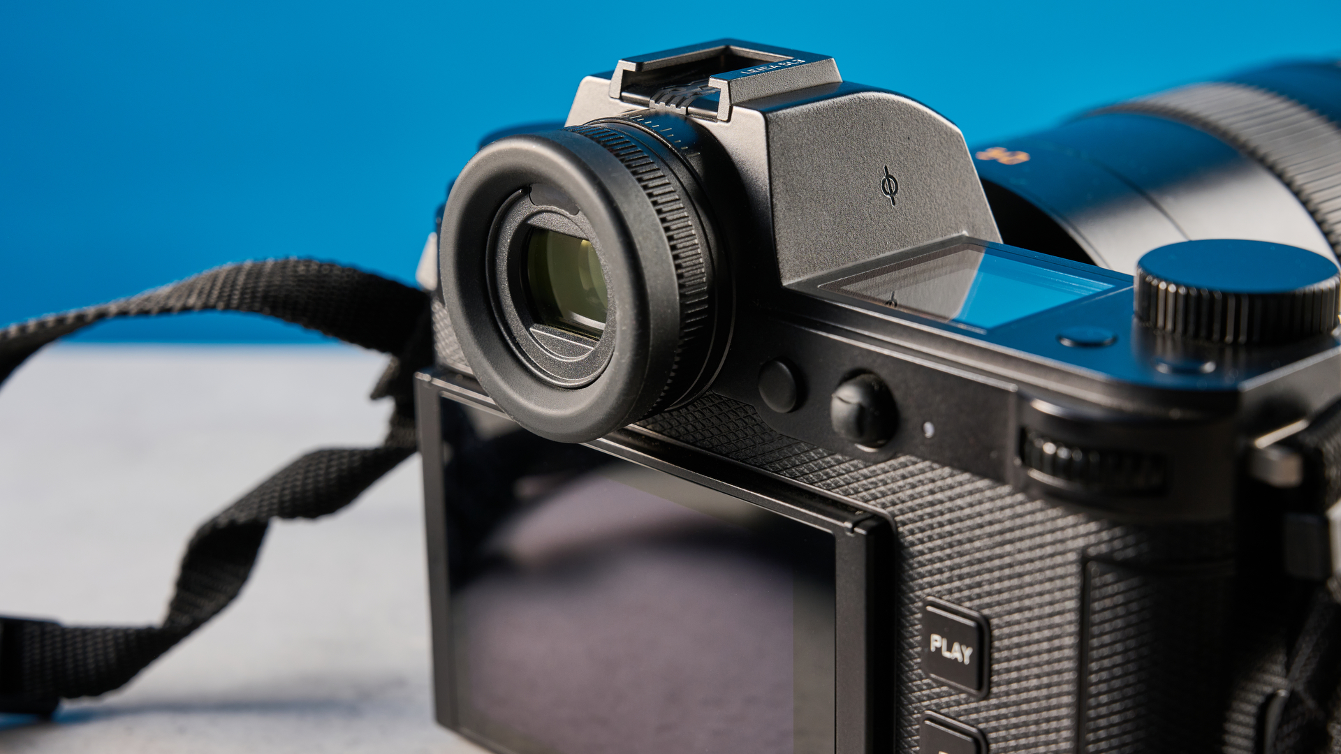 A black Leica SL3 mirrorless full frame camera