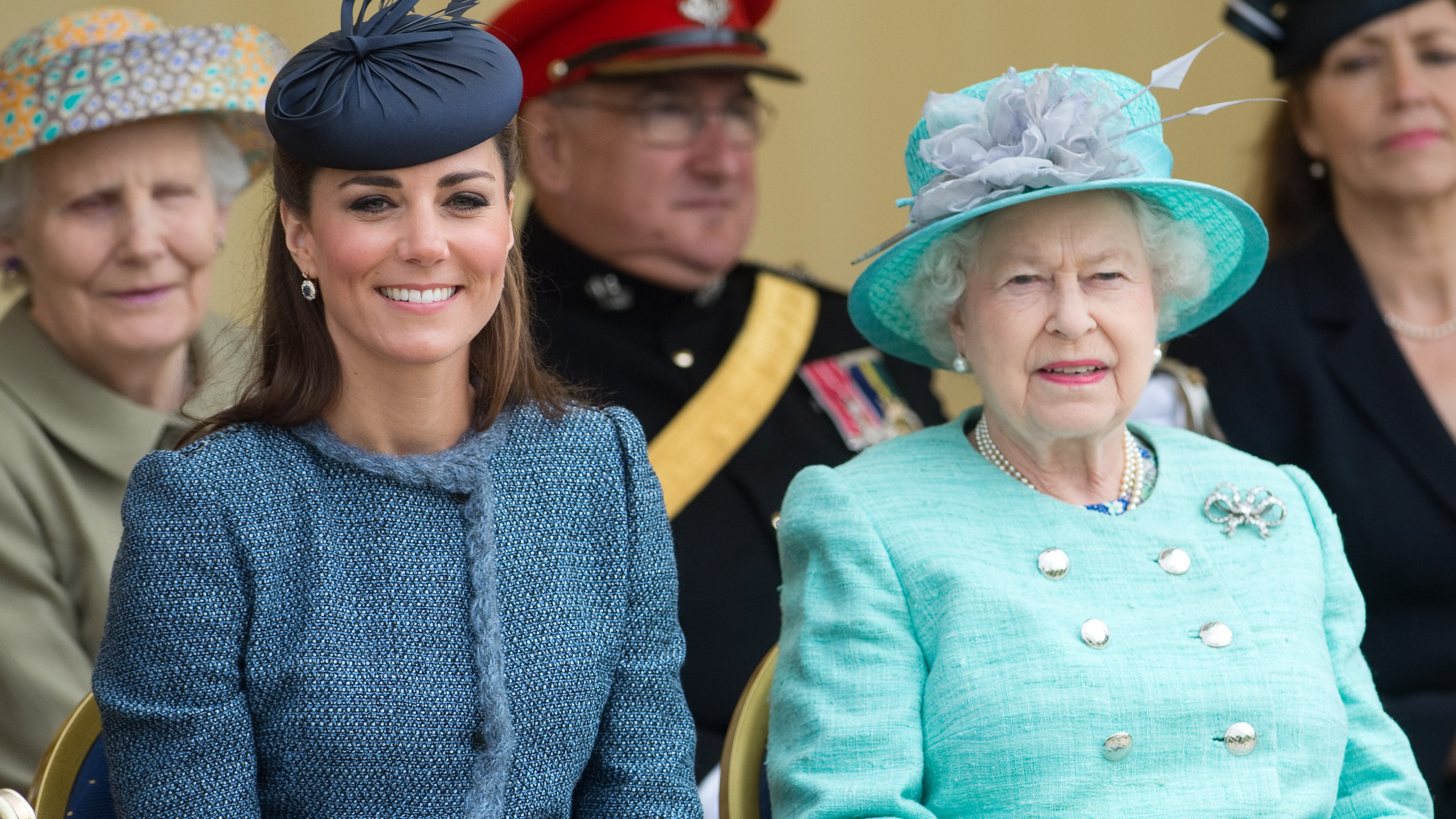 Queen Elizabeth II and Catherine, Princess of Wales smile, sitting down, as they make a Diamond Jubilee visit to Nottingham on June 13, 2012