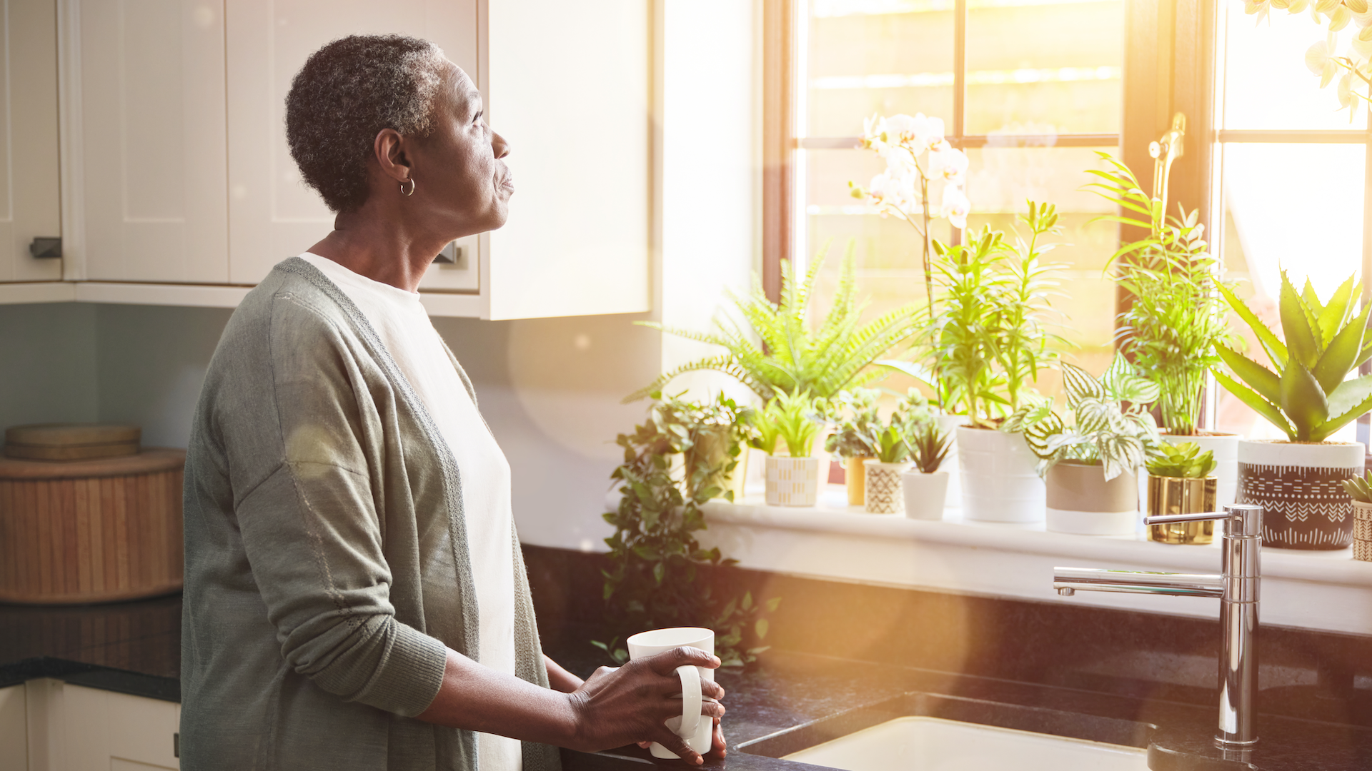 woman looking out window