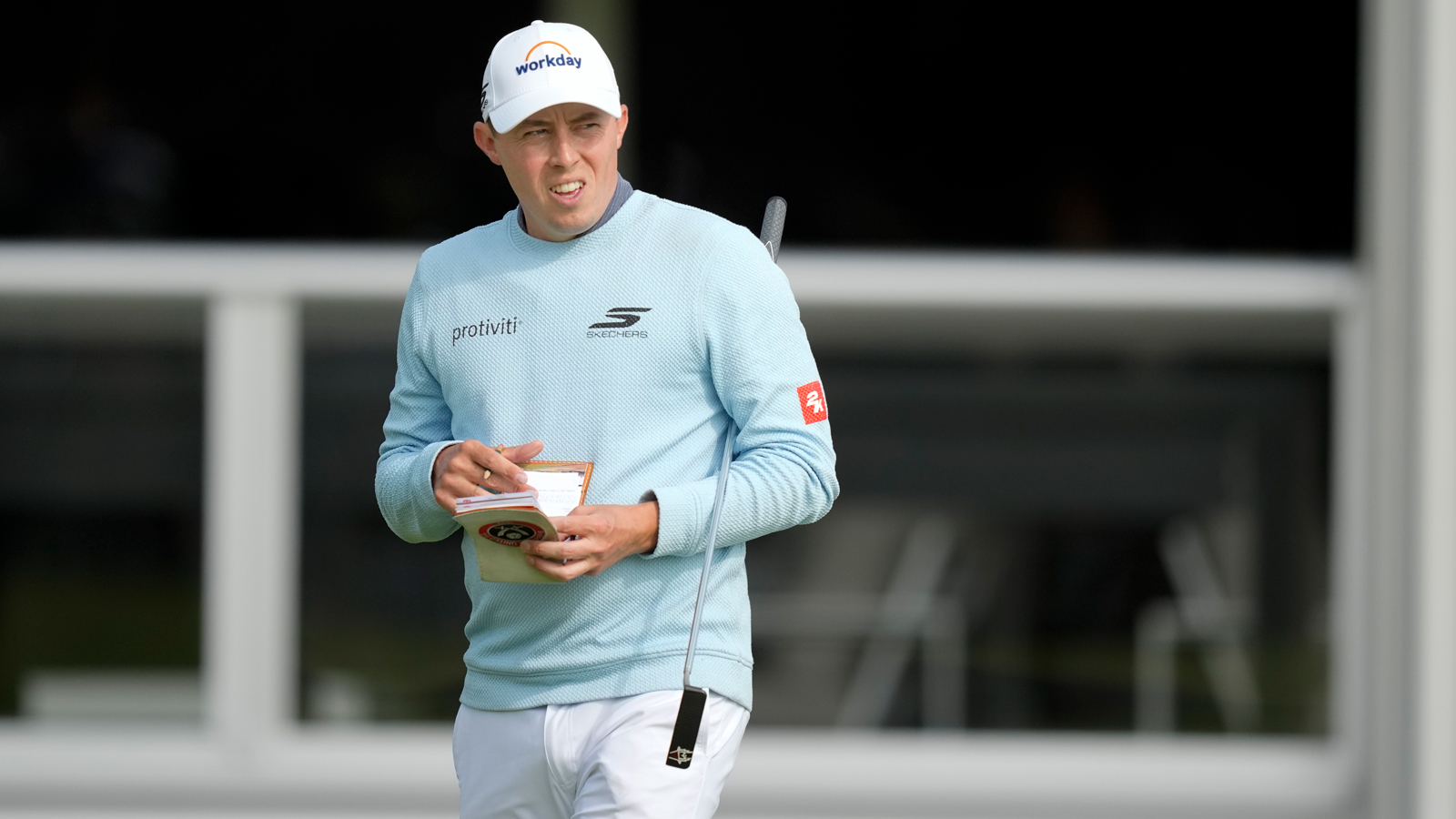 Matt Fitzpatrick writes in a yardage book