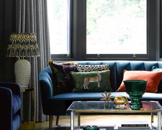 A Pooky living room with blue velvet sofa