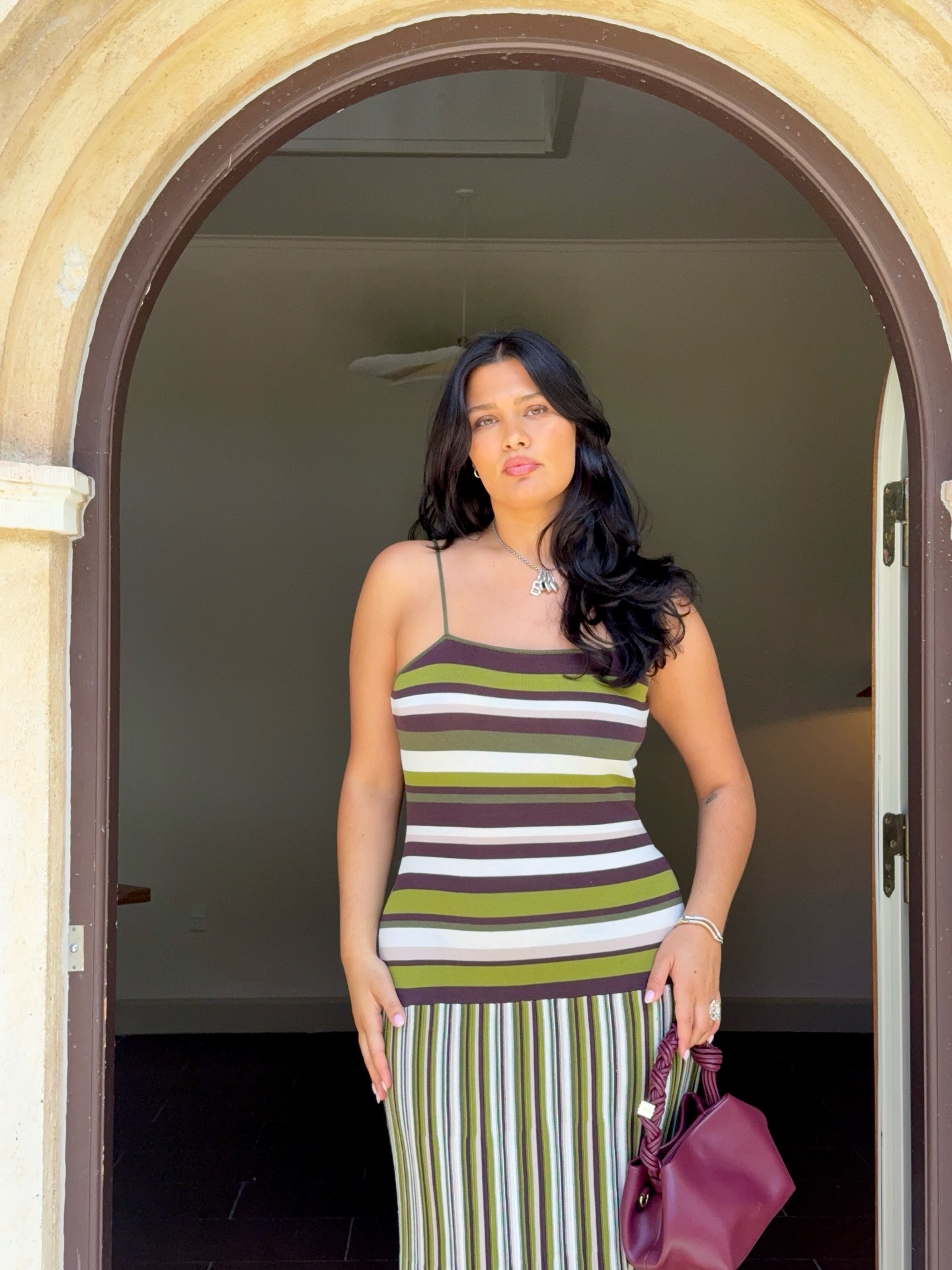 An image of a woman wearing striped dress for summer 2026