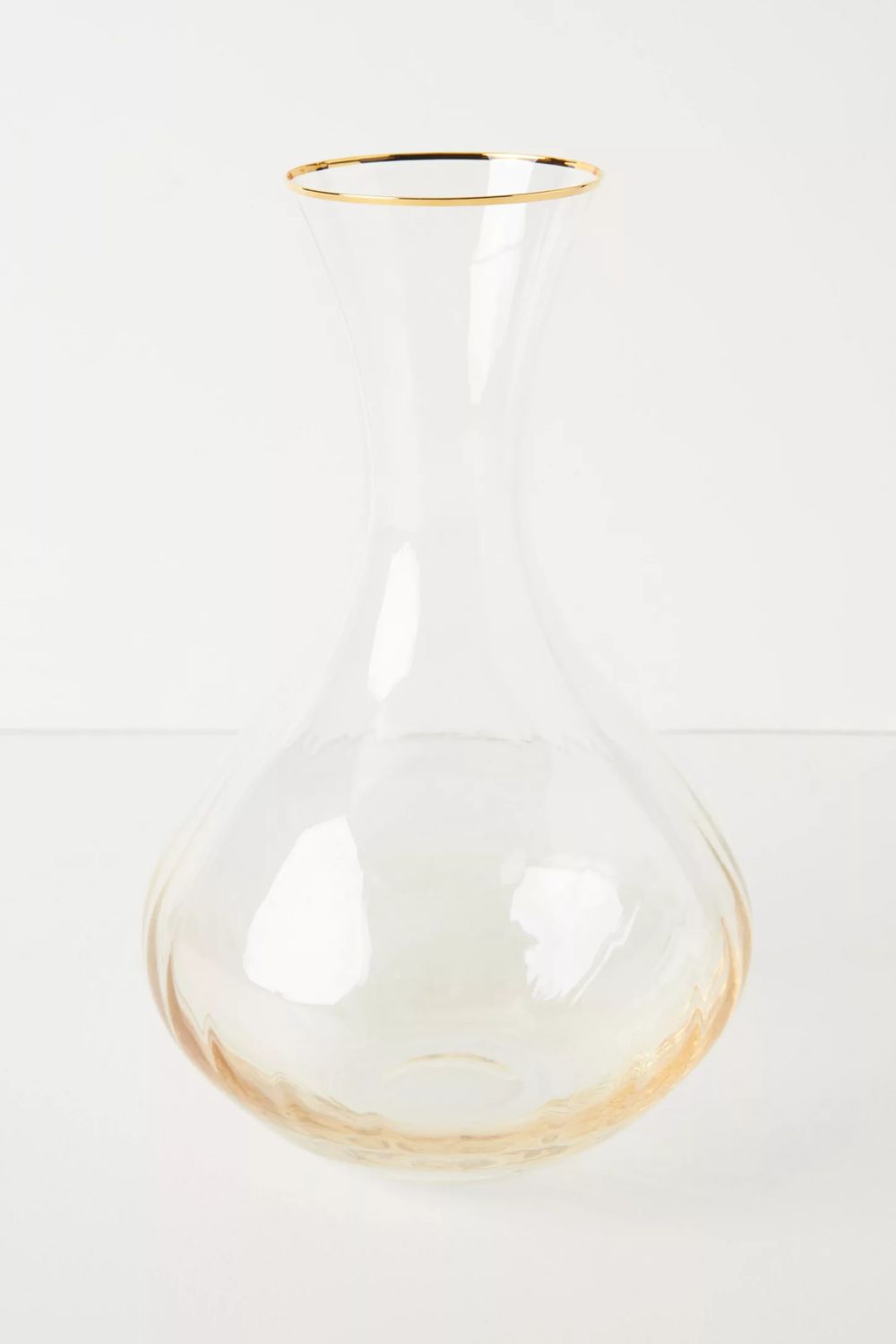 Ribbed amber carafe with gold rim