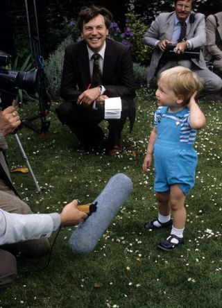 Prince William, aged two, with press