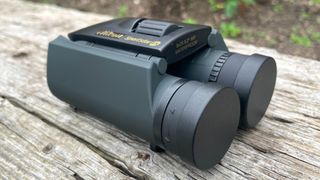 Nikon Trailblazer outside on a wooden table