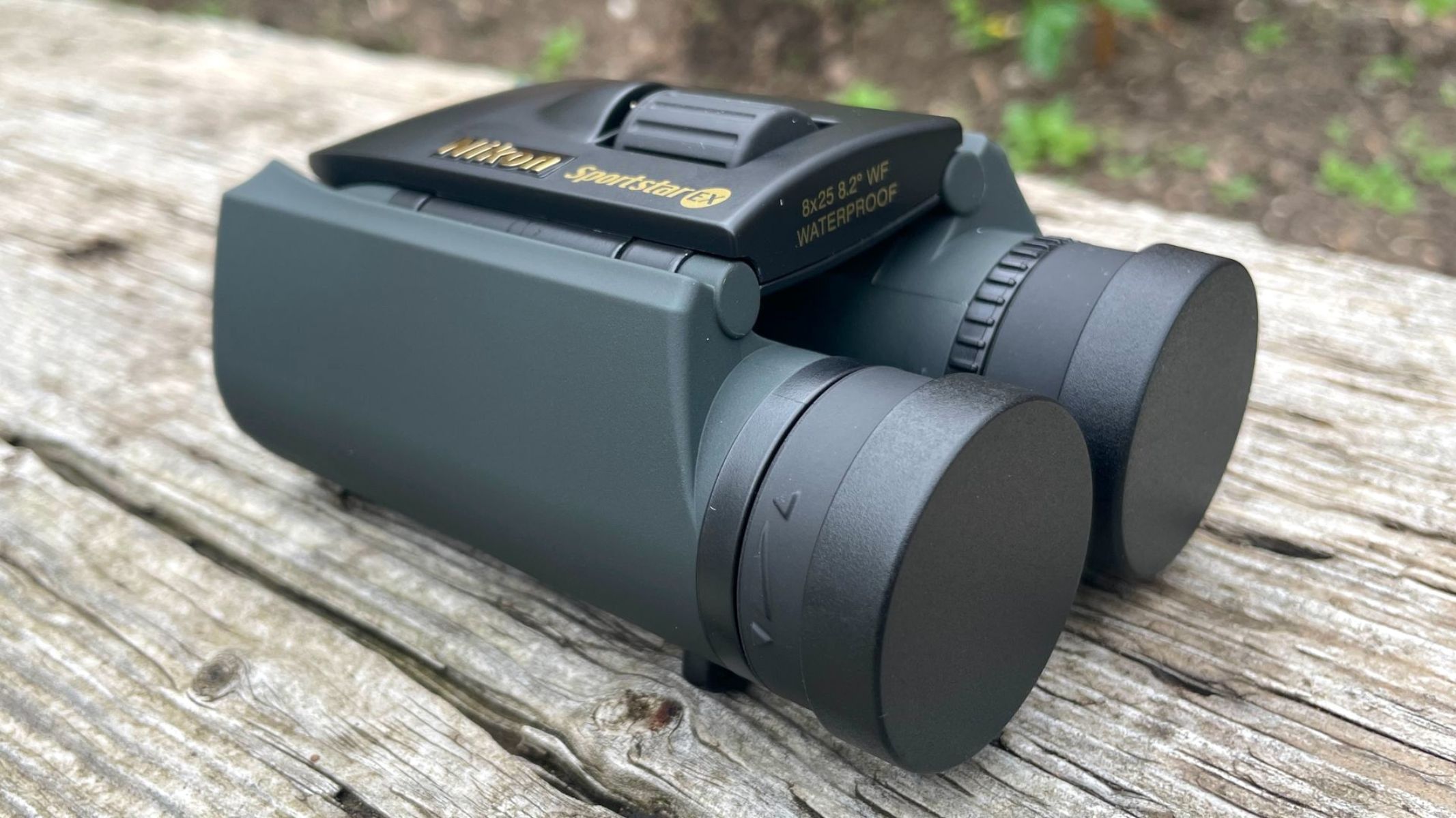 Nikon Trailblazer outside on a wooden table