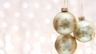 glittery background with three hanging baubles