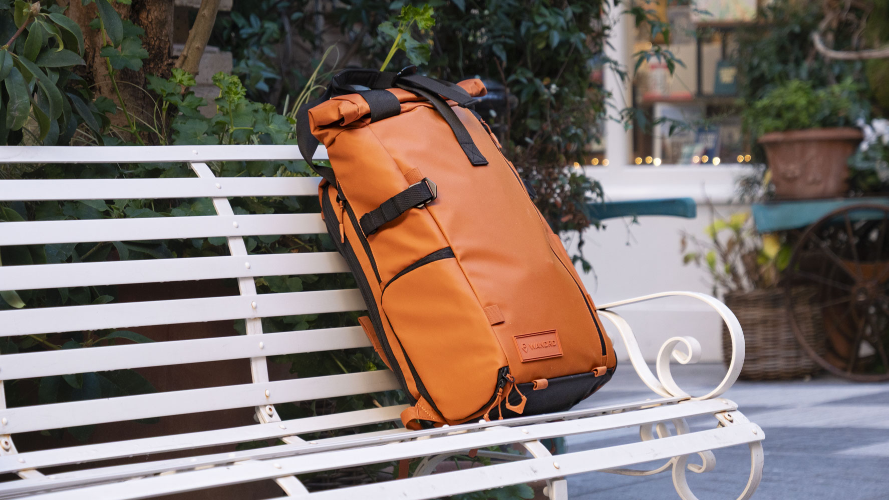 Wandrd PRVKE V4 bag on a white metal bench 