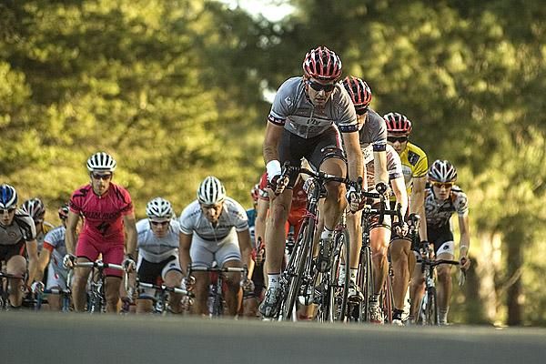 American Curtis Gunn (Fly V Australia) driving the peloton with seven laps remaining.
