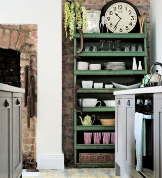 shabby chic kitchen with green industrial style cabinet