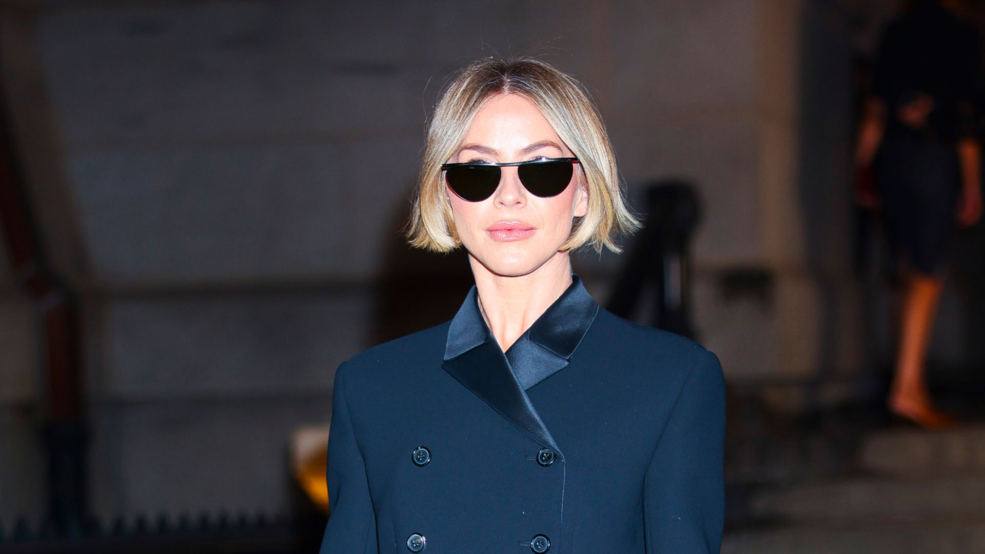 Julianne Hough wearing a navy blazer, blue jeans, and heels