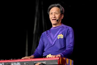 Jeff Fatt on stage as the Purple Wiggle