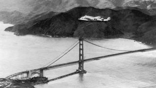 The Lockheed Electra "Flying Laboratory," piloted by American aviator Amelia Earhart and Fred Noonan, flies over the Golden Gate Bridge in California, at the start of a planned round-the-world flight on March 17, 1937.