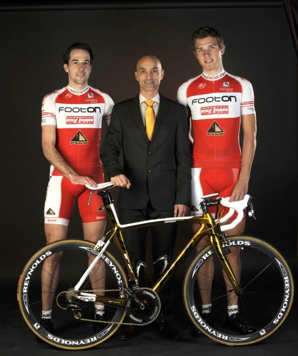 The Austrian riders of Footon-Servetto-Fuji, Markus Eibegger and Matthias Br&auml;ndle, escort team general manager Mauro Gianetti
