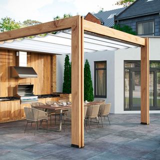 outdoor kitchen with retractable cover and dining table and chair