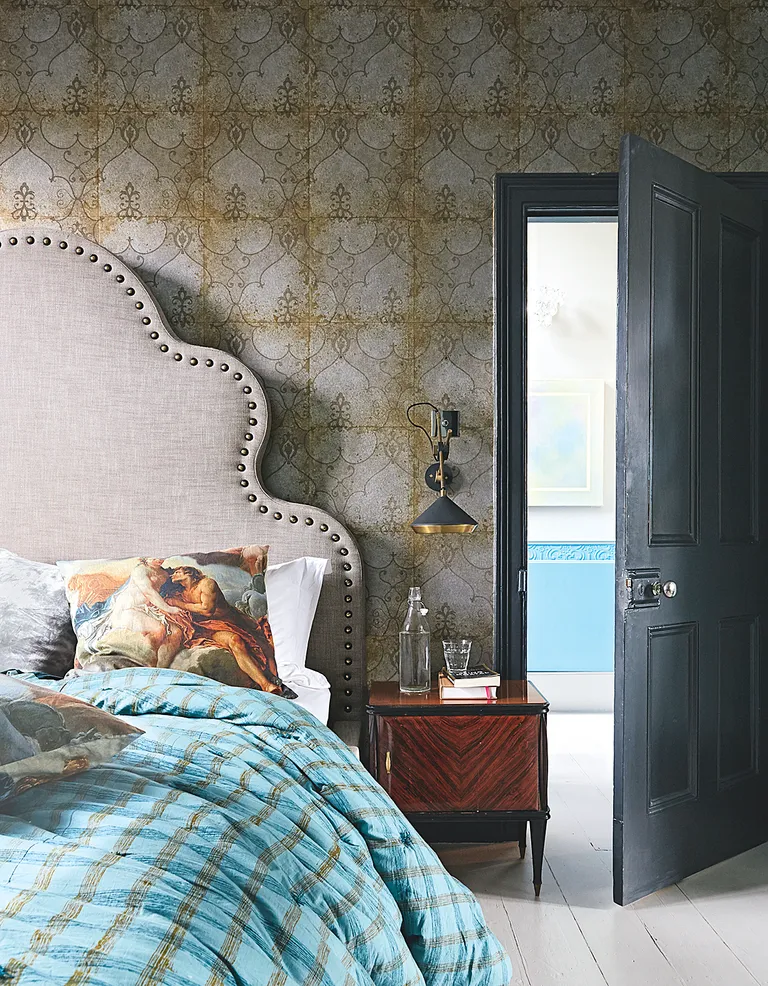Bedroom with vintage style wallpaper and headboard