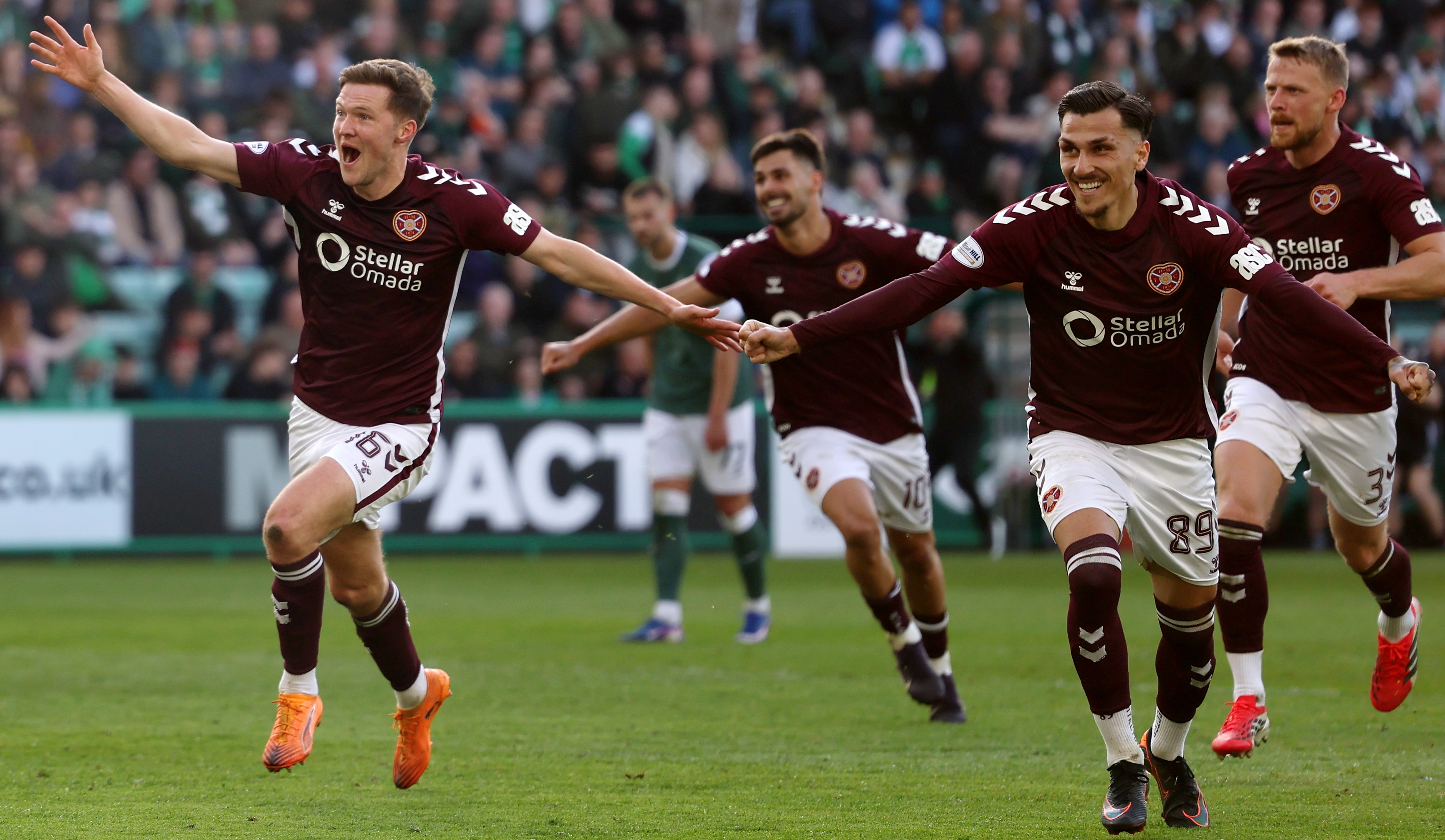 Hearts celebrate their late winner against Hibernian in the Scottish Premiership