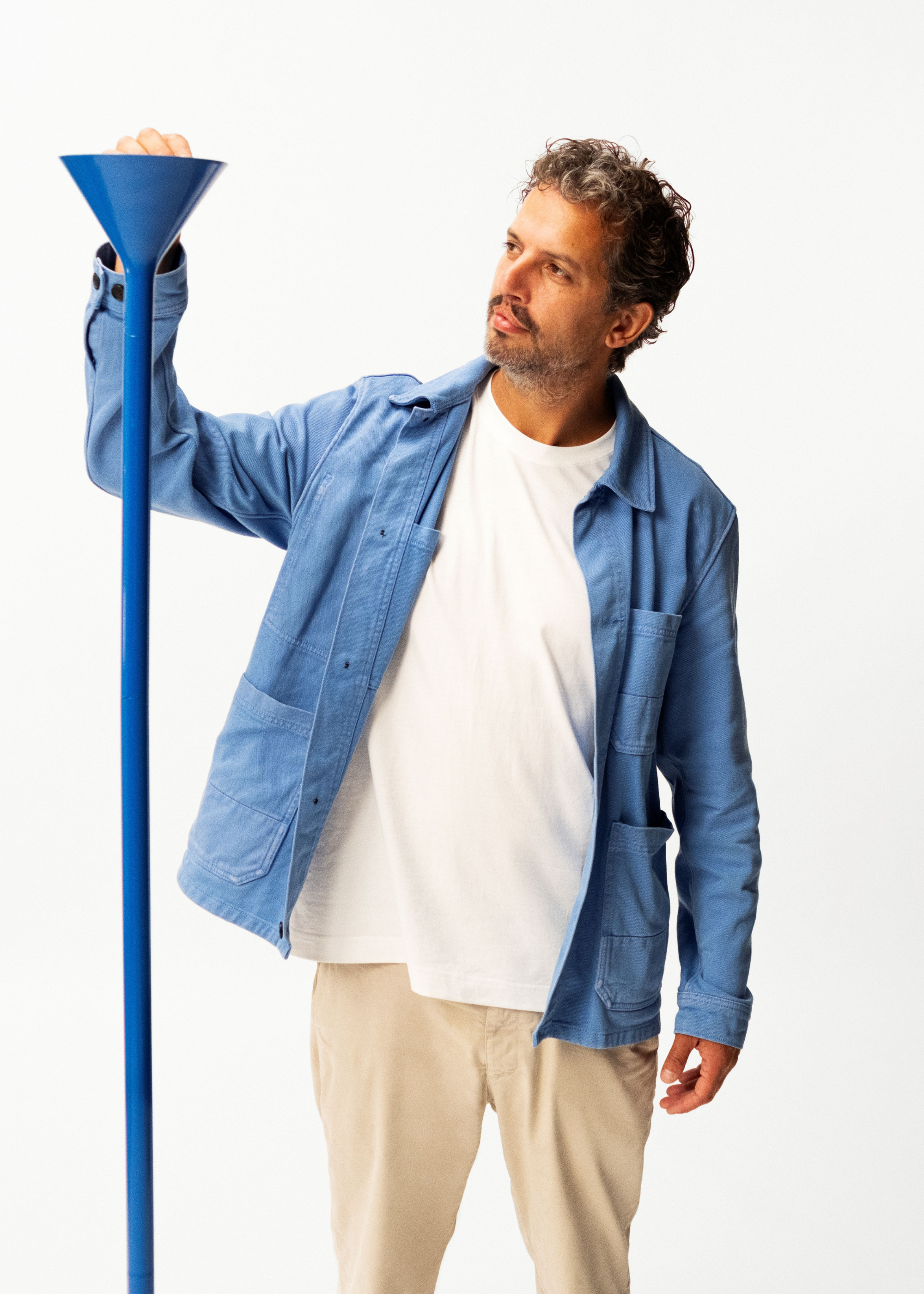Designer, lex pott alongside his IKEA PS Collection lamp in cobalt blue
