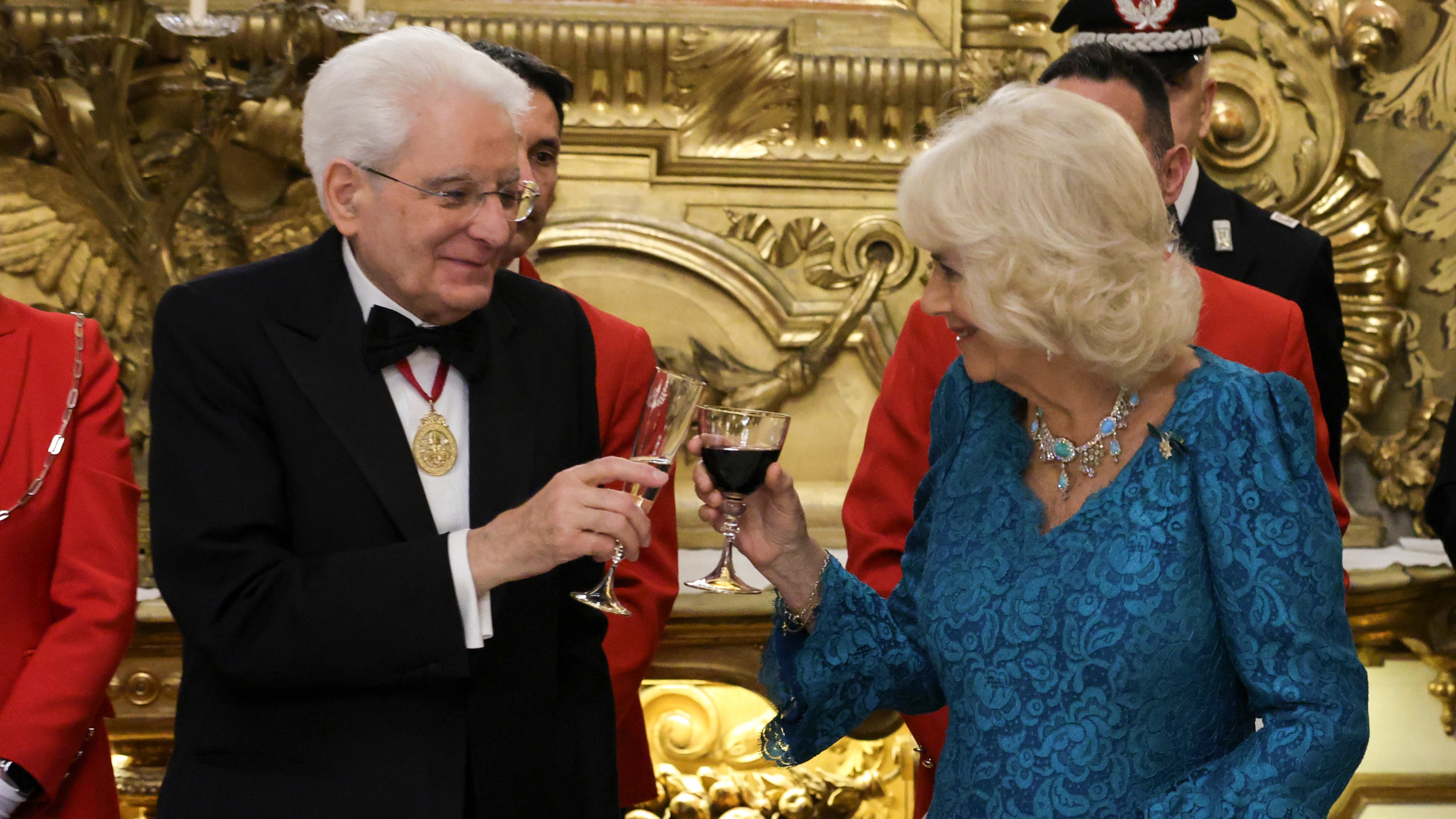 Queen Camilla makes a toast with President of Italy Sergio Mattarella at a State Banquet