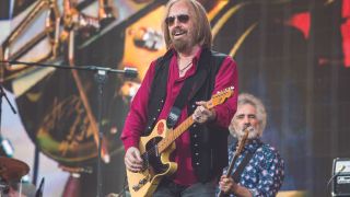 a shot of tom petty on stage