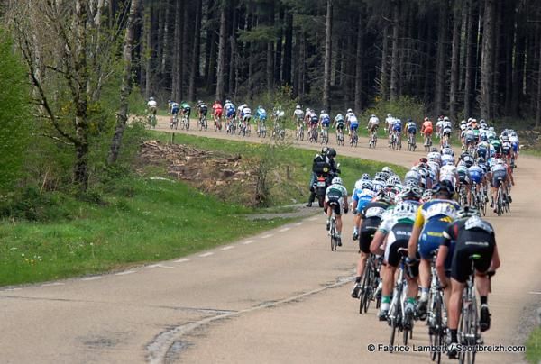 The peloton winds through the Brittany countryside.