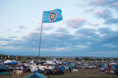 A Standing Rock Sioux flag flies over a protest encampment near Cannon Ball, North Dakota