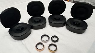 RingConn Smart Ring in various sizes with cases on a table at IFA 2024