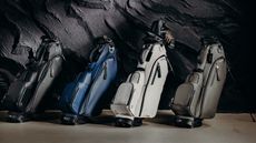 Four Vessel golf bags indoors