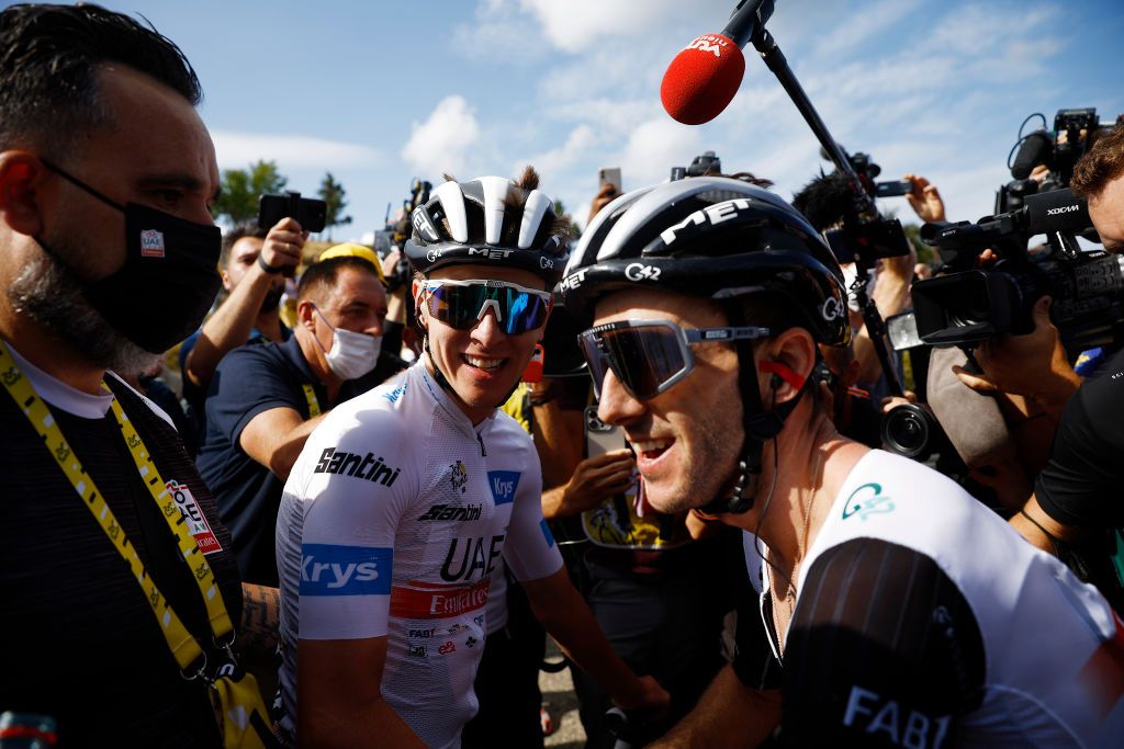 Stage winner Tadej Pogacar (UAE Team Emirates) celebrates his stage win with his teammates