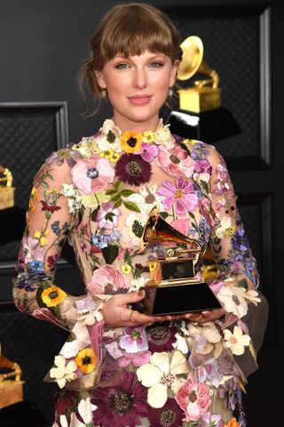 Taylor Swift wears an oscar de la renta dress to the 2021 Grammy Awards