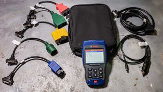 Bosch OBD 1300 on table with multiple cords