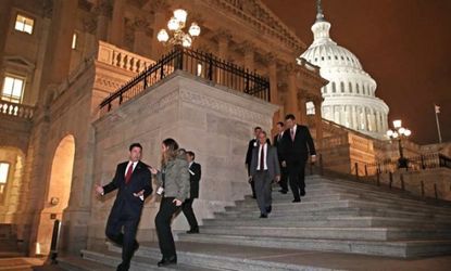 Members of the House leave after voting for legislation to avoid the fiscal cliff on Jan. 1.