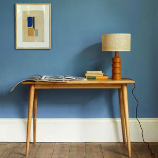 Blue hallway with wooden table