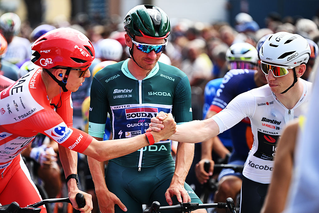 GRUISSAN - AUDE, FRANCE - AUGUST 24: (L-R) Tadej Pogacar of Slovenia and UAE Team Emirates XRG - Red Leader Jersey, Ethan Hayter of Great Britain and Team Soudal Quick-Step - Green points jersey and Matthew Brennan of Great Britain and Team Visma | Lease a Bike - White Most Combative Rider Jersey prior to the La Vuelta - 81st Tour of Spain 2026, Stage 3 a 174km from Gruissan - Aude to Font Romeu 1941m / #UCIWT / on August 24, 2026 in Gruissan - Aude, France. (Photo by Tim de Waele/Getty Images)
