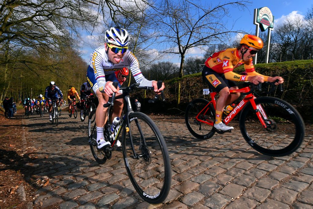 KOKSIJDE BELGIUM MARCH 19 Dusan Rajovic of Serbia and Team Delko Kristoffer Halvorsen of Norway and Uno X Pro Cycling Team during the 19th Bredene Koksijde Classic 2021 a 199km race from Bredene to Koksijde Kemmelberg Cobblestones BredeneKoksijde on March 19 2021 in Koksijde Belgium Photo by Luc ClaessenGetty Images