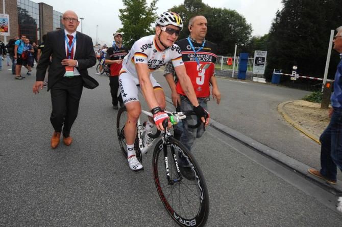Andre Greipel (Lotto-Belisol) gets escorted to the podium