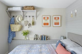 country bedroom with panel wall and hooks