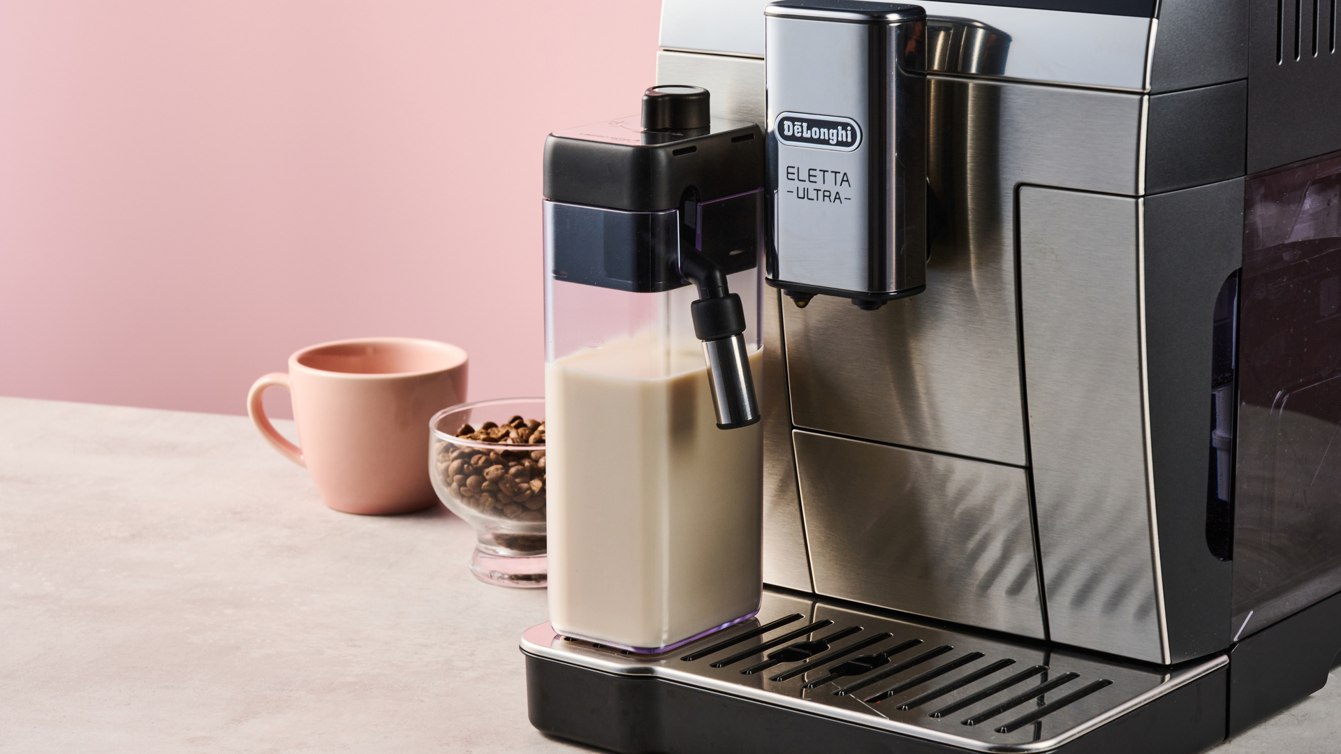 A closeup of the De'Longhi Eletta Ultra's hot milk carafe.