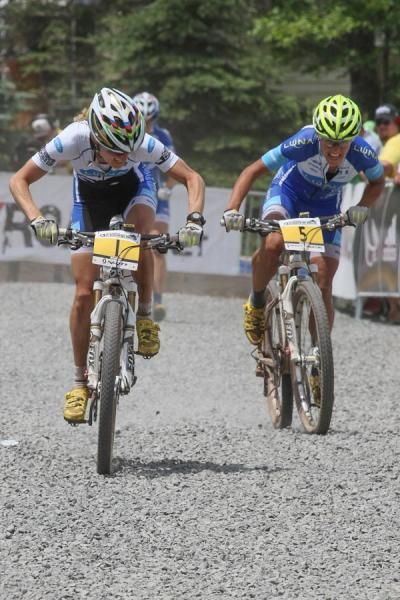Catharine Pendrel and Katerina Nash sprint for the line around their sobbing Luna teammate.