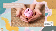 Piggy bank with adult and child hands holding