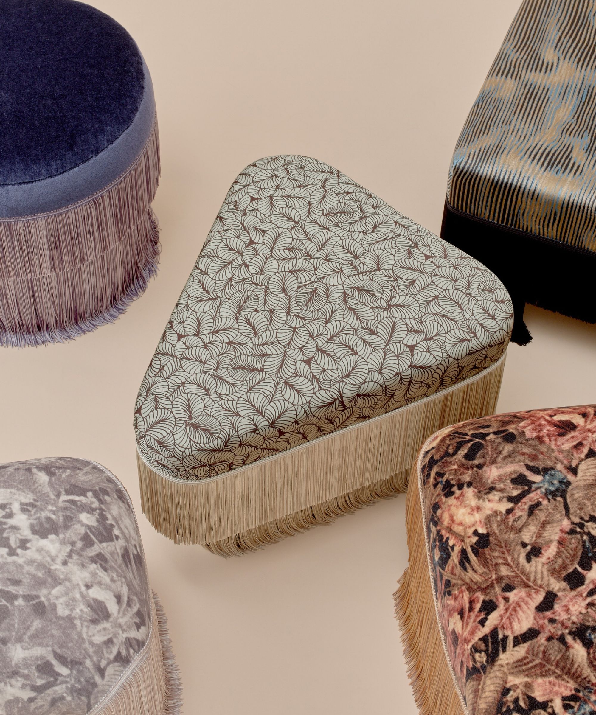 five ottomans with fringing